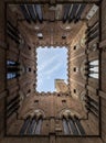 View of the Torre del Mangia inside the public palace of Siena Royalty Free Stock Photo